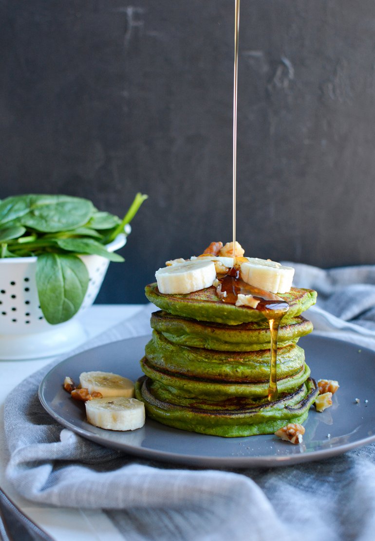 green smoothie pancakes with syrup drip