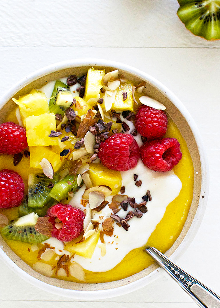mango creamsicle smoothie bowl with toppings