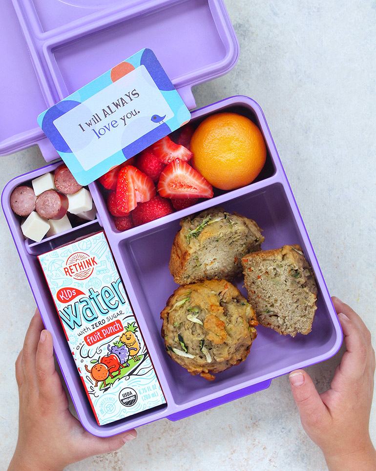purple lunchbox with zucchini muffins