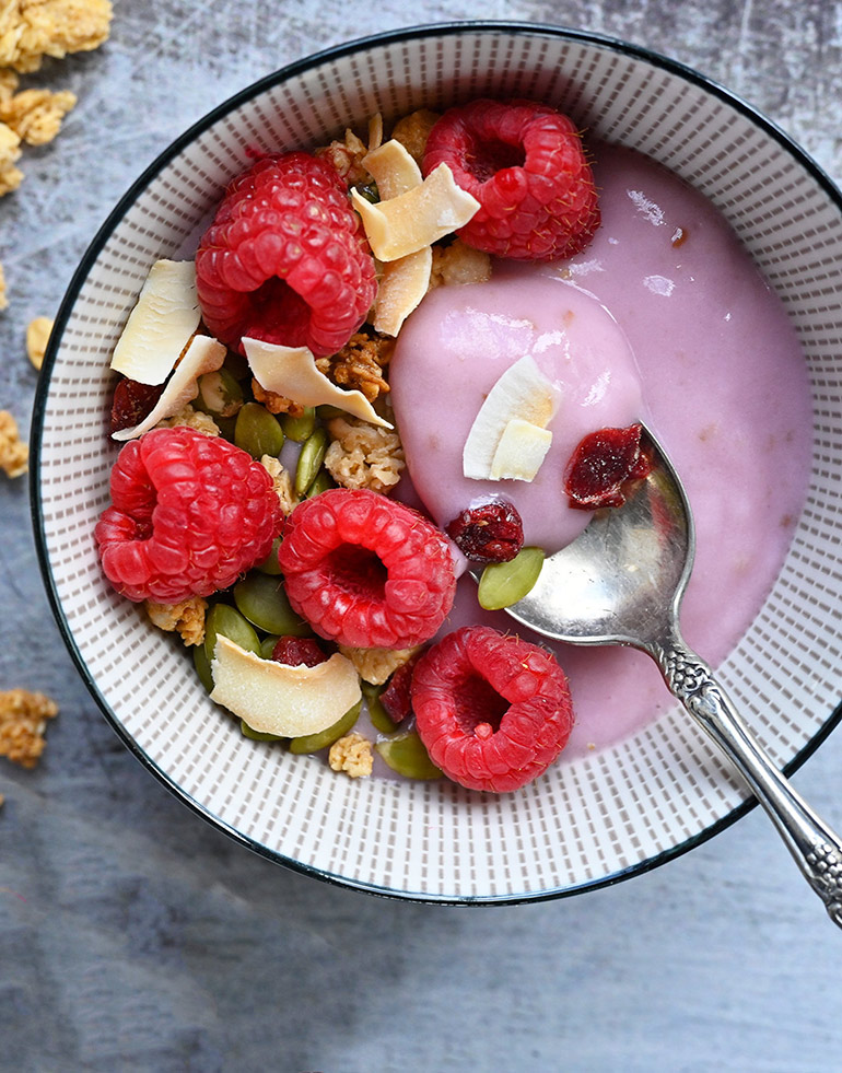 close up of raspberry yogurt parfait