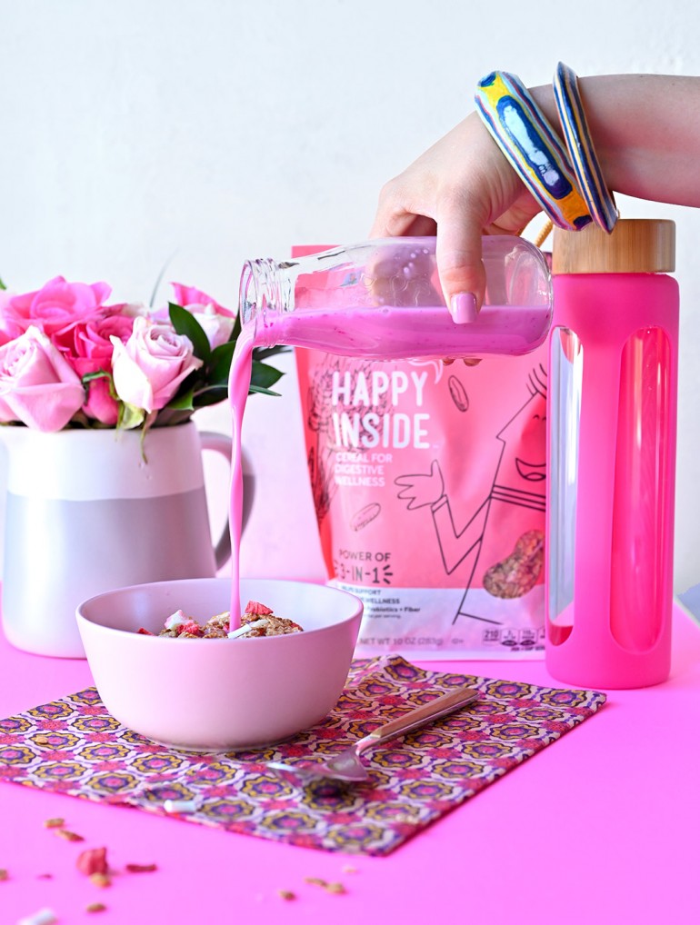 pouring milk into happy inside strawberry cereal