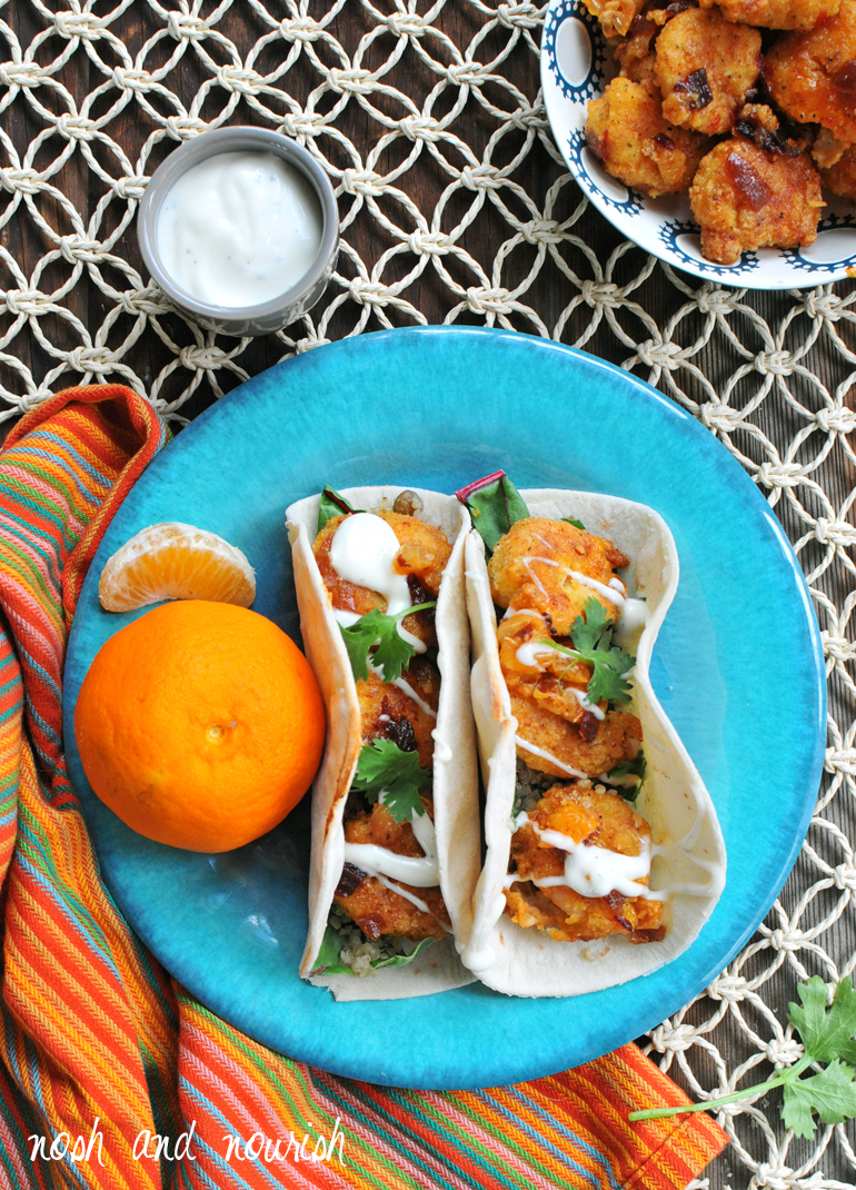 criispy honey chipotle shrimp tacos on a plate