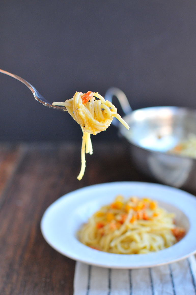 orange power pasta fork with noodles