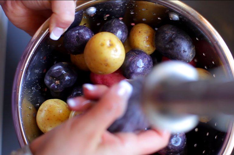 washing colorful potatoes