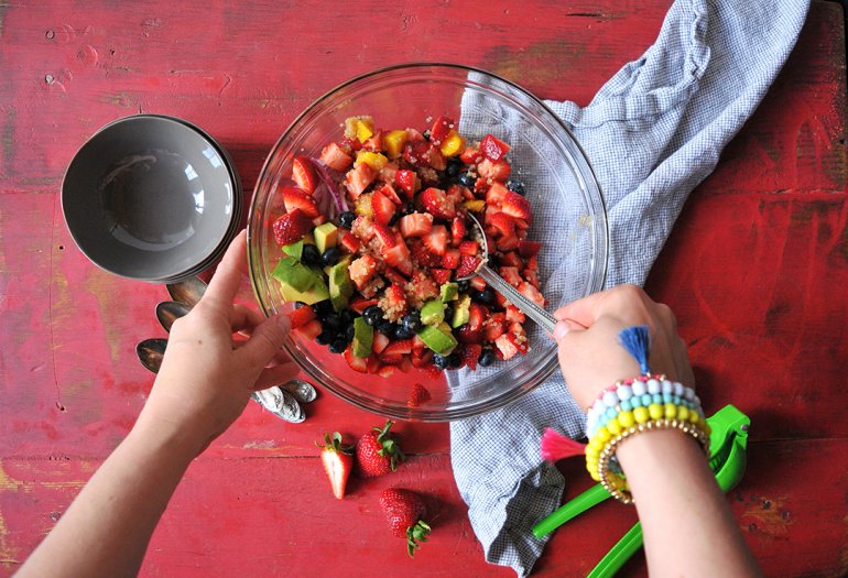 strawberry quinoa fruit salad stirring